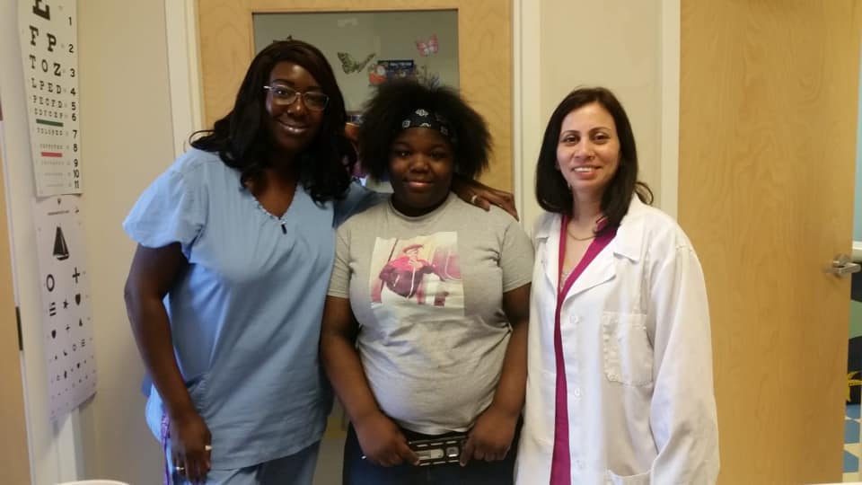 Newborn care services showing gentle pediatric examination in safe medical setting